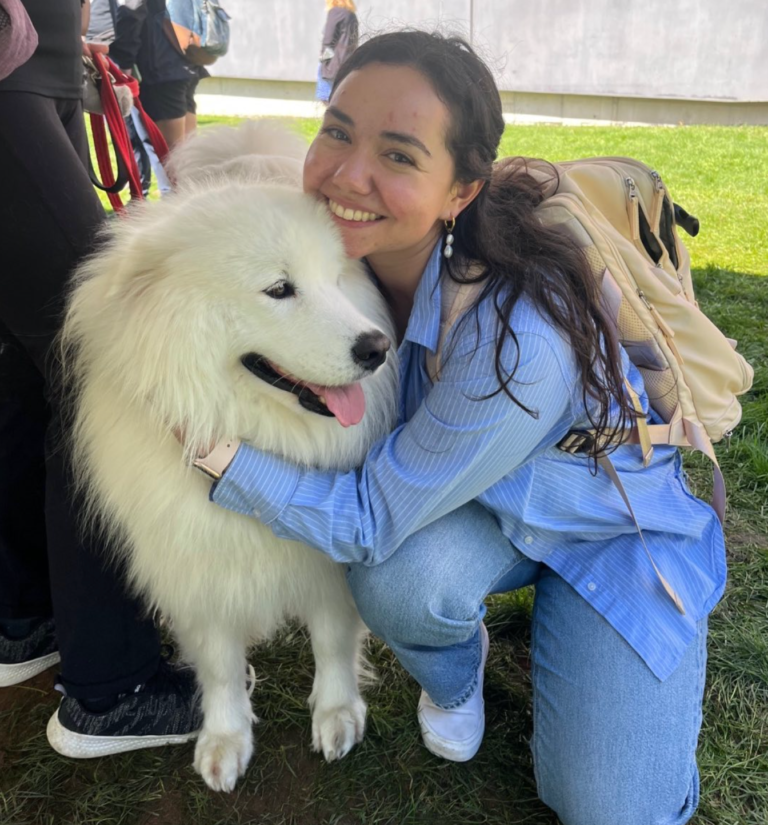 Person hugging Laika Blue at Yale Health event